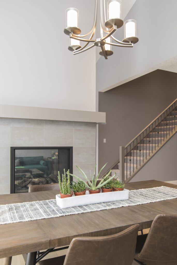 beautiful-shot-modern-house-dining-room-with-plants-fireplace-scaled.jpg